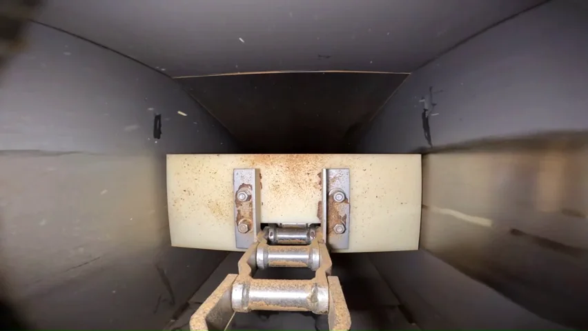 Interior view of an enclosed conveyor captured during inspection